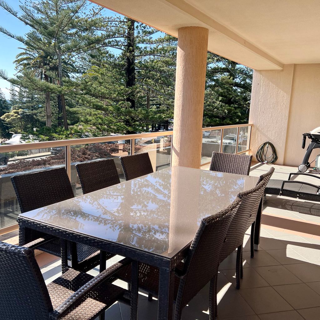 Balcony with outdoor dining and BBQ.