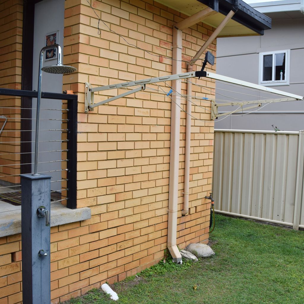 Outdoor shower and clothes line.