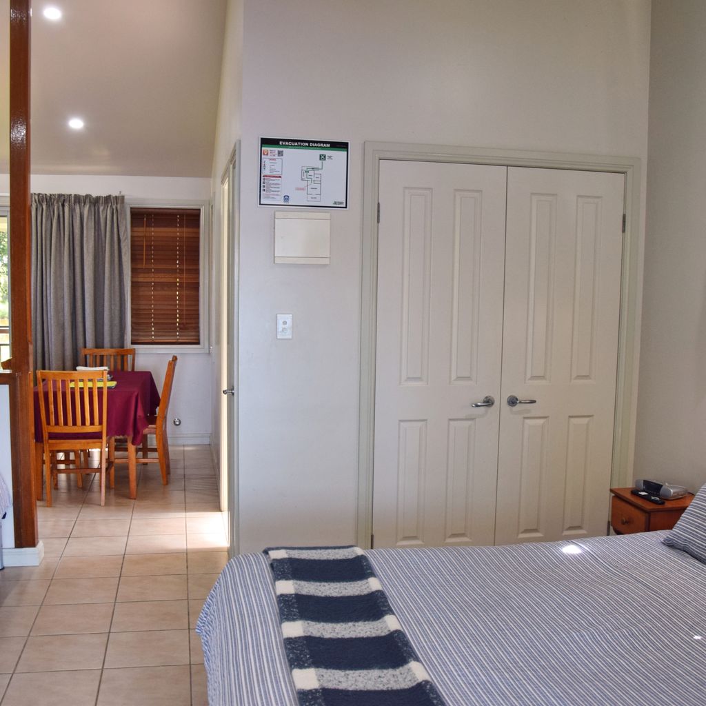 Bedroom with dining area in the back.