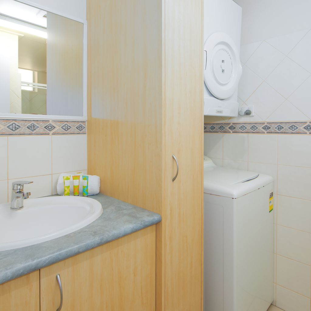 Bathroom with shower - laundry with washer and dryer