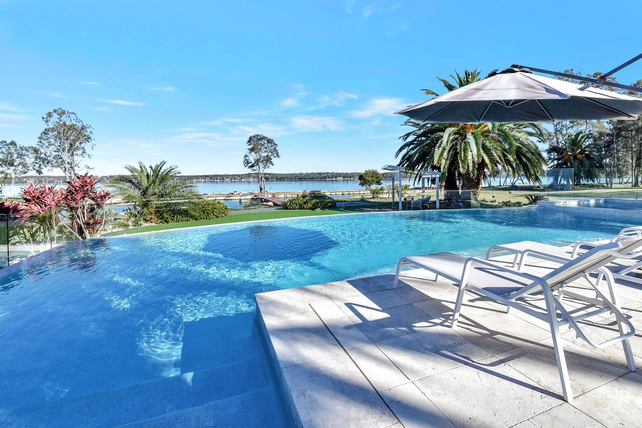  Lake Palm Resort Luxury Retreat absolute Waterfront on 3 acres at Lake Macquarie. 