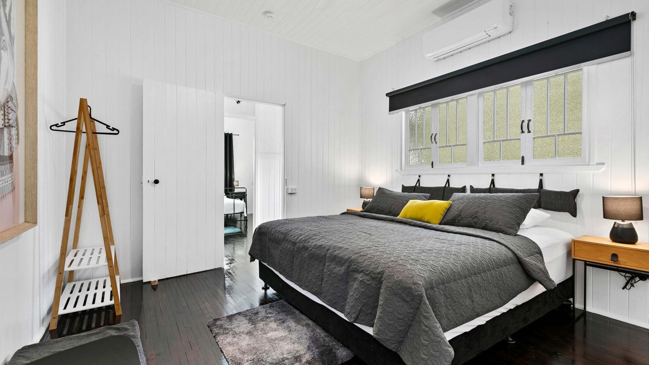 Unwind in the luxurious master bedroom featuring a king-sized bed and air conditioning, ensuring a tranquil and cozy haven for a restful night's sleep. This elegantly appointed space is designed to provide the utmost comfort, inviting you to relax and rec