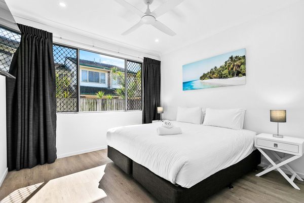 Savor the scenic beauty from the master's bedroom, featuring wide windows that frame a captivating view, creating a serene and picturesque retreat.