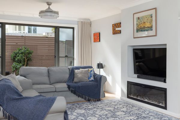 This open-plan townhouse has a comfy living room with enough seating for everyone and a flat-screen TV. 