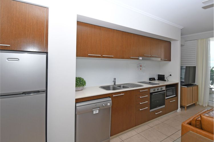 Step into our simple yet well-equipped kitchen—a culinary haven designed for practicality and functionality. Despite its simplicity, this kitchen is thoughtfully arranged with modern appliances and essential tools, ensuring a seamless cooking experience.