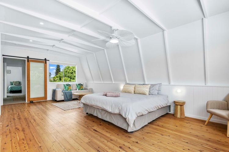 Welcome to our bedroom retreat, where comfort takes center stage. A cozy couch complements the sleeping space, offering a versatile corner for relaxation, reading, or simply unwinding.