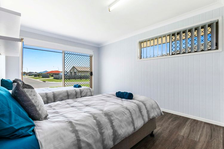 Embrace serenity in our beautiful bedroom, adorned with wide windows that invite the outside world in.