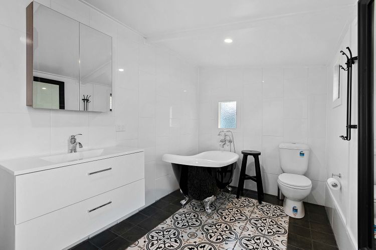 Indulge in luxury in our bathroom with a bathtub, offering a perfect retreat for relaxation. Immerse yourself in a soothing bath, unwind, and rejuvenate in this serene and inviting space.