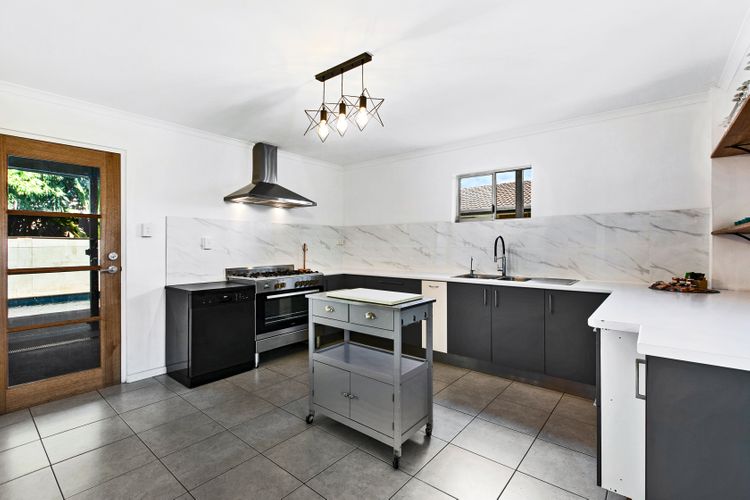 Welcome to our clean and spacious kitchen, where culinary adventures come to life amidst gleaming countertops and ample space to create. From meal prep to family gatherings, savor the joy of cooking in this inviting culinary haven