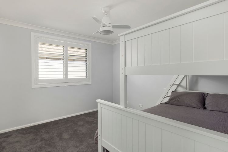 Bedroom 4 has a Tribunk with 1 Queen bed and 2 single beds. It has a ceiling fan for cool ventilation and a built-in robe. 