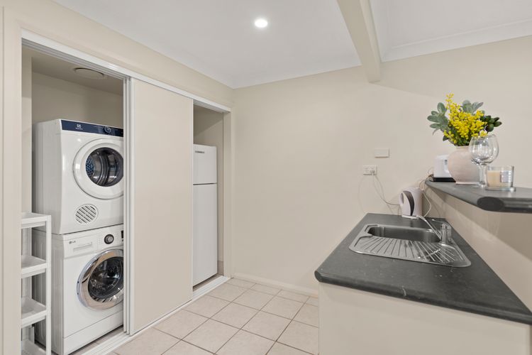 Internal laundry with additional fridge and sink