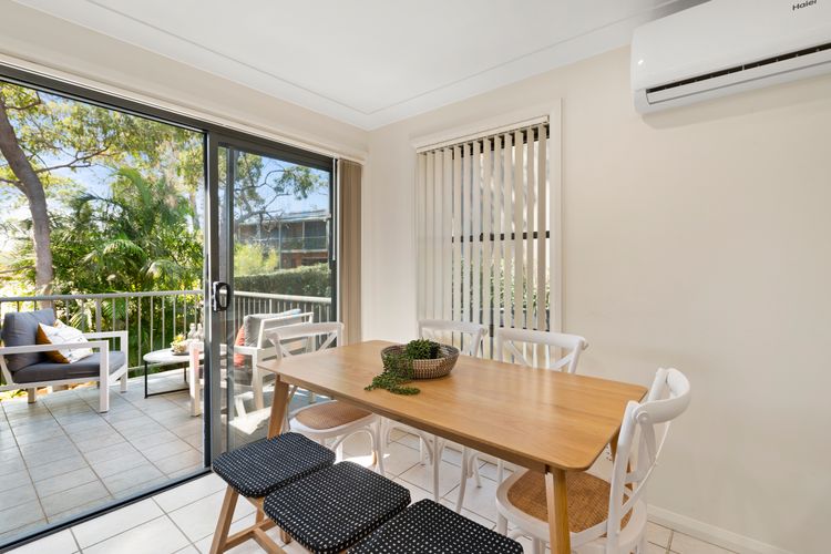 Bright dining area with direct balcony access
