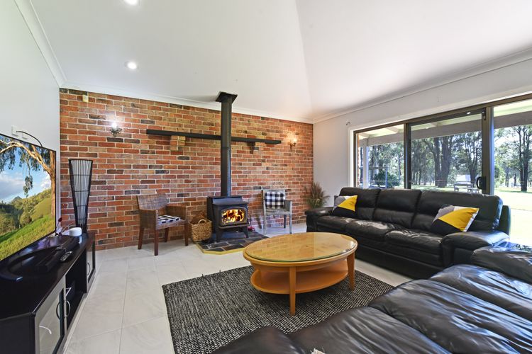 Cosy lounge room with fireplace and flat screen TV