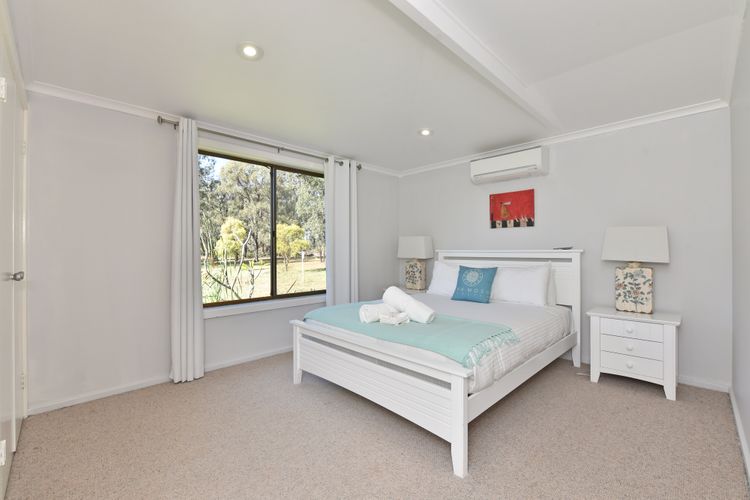 Bedroom with queen size bed and aircon