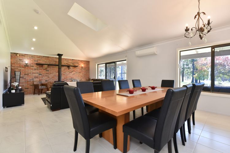 Open plan lounge and dining room with fireplace 