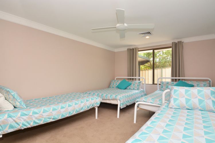 Bedroom with 1 queen, 1 double and 2 singles 
