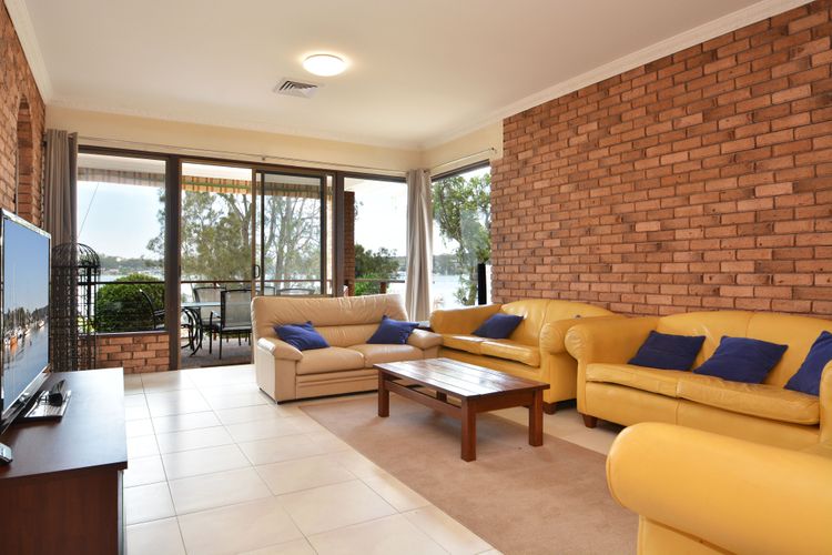 Loungeroom with flatscreen TV and amazing views of the water