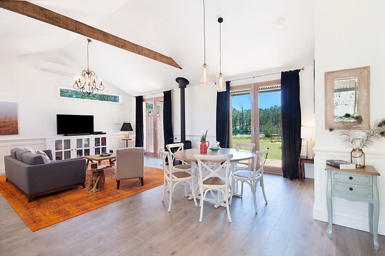 Luxe dining and lounge room with fireplace