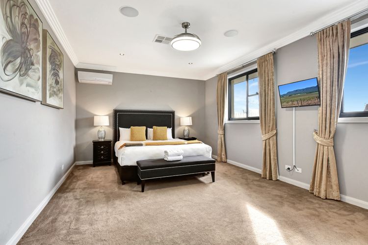 Luxe Bedroom with King Bed and Flat Screen TV