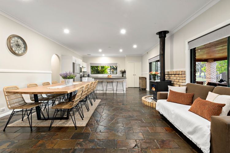 Dinging room with 10 seater dining table and fireplace 