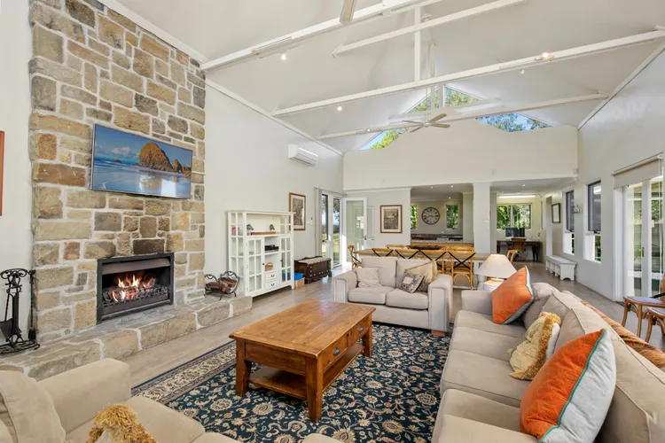 Lounge room with fireplace and flat screen TV