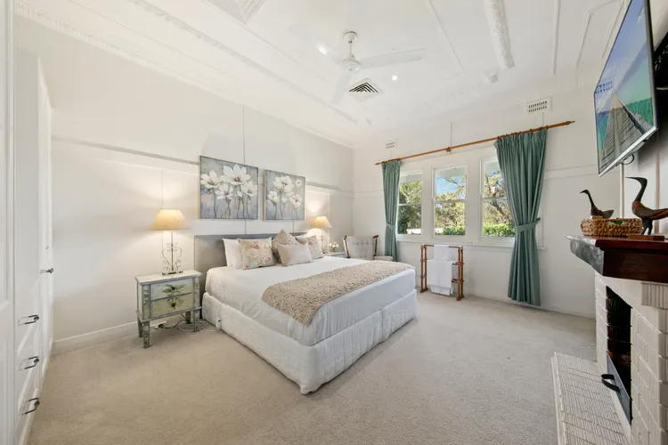 Large bedroom with king size bed and flat screen TV