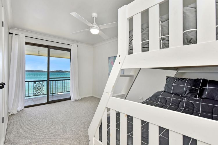 Bedroom wtih balcony and water views 