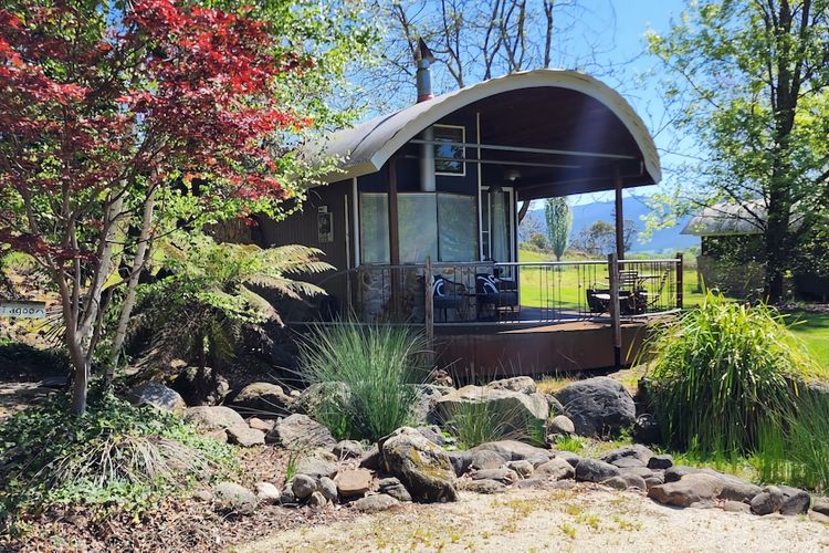 Dome retreat with front verandah, front lawn and shady trees