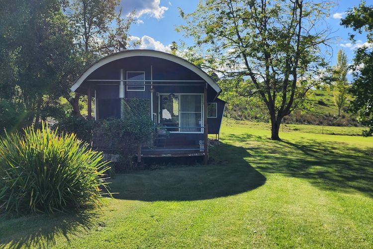 Dome retreat with front lawn and shady trees 