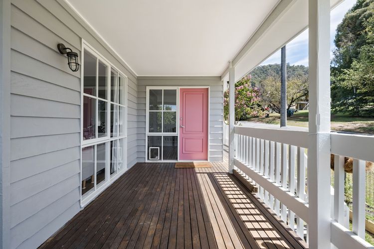 Welcome to the front entrance featuring a stunning pink door! Remember to remove your shoes before stepping inside!