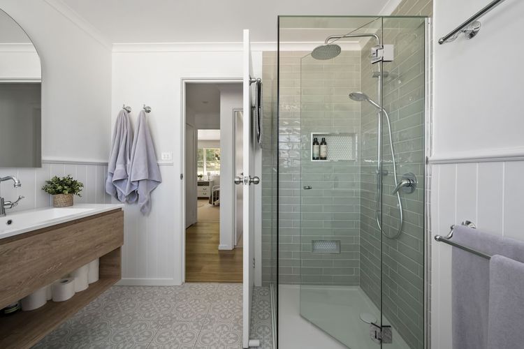 Master bathroom boasts a huge bathtub, toilet and separate shower featuring dual shower heads. 