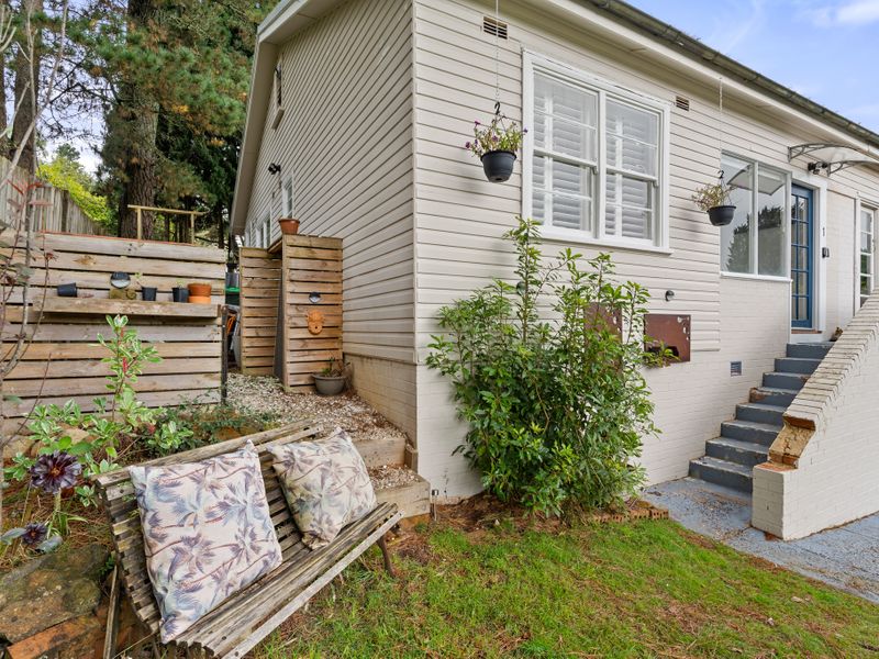 Inviting Garden Path: A peaceful garden path leads to the side entry, offering a tranquil vibe.