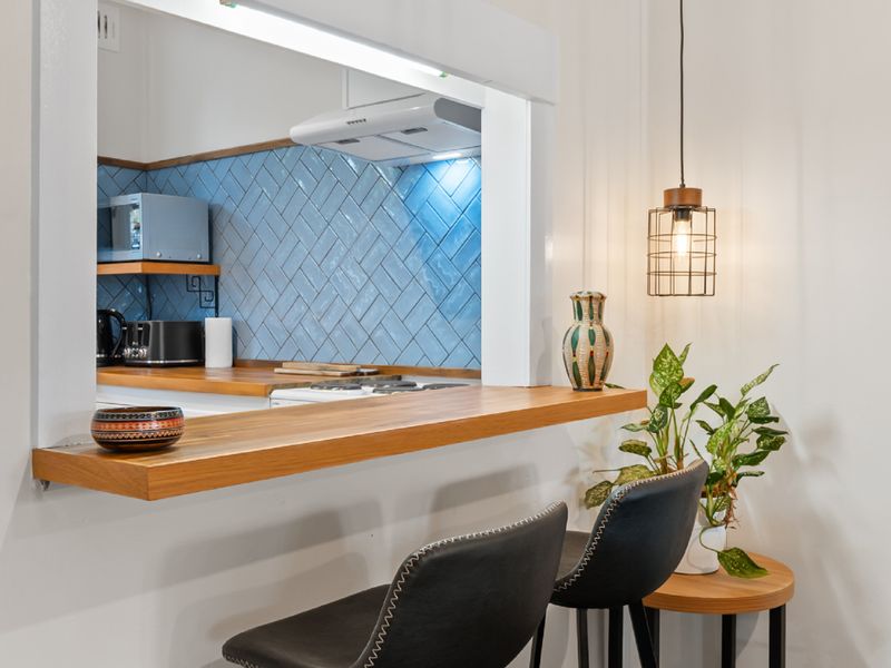 Cozy breakfast nook with stylish bar stools.