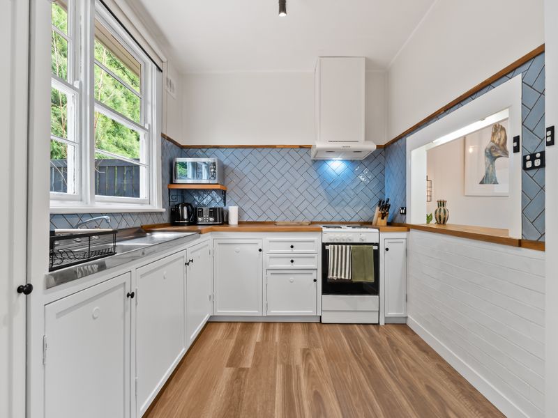 Bright kitchen with natural light and updated appliances.