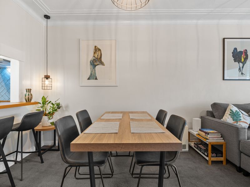 Relax in comfort with a spacious living room and beautiful art.