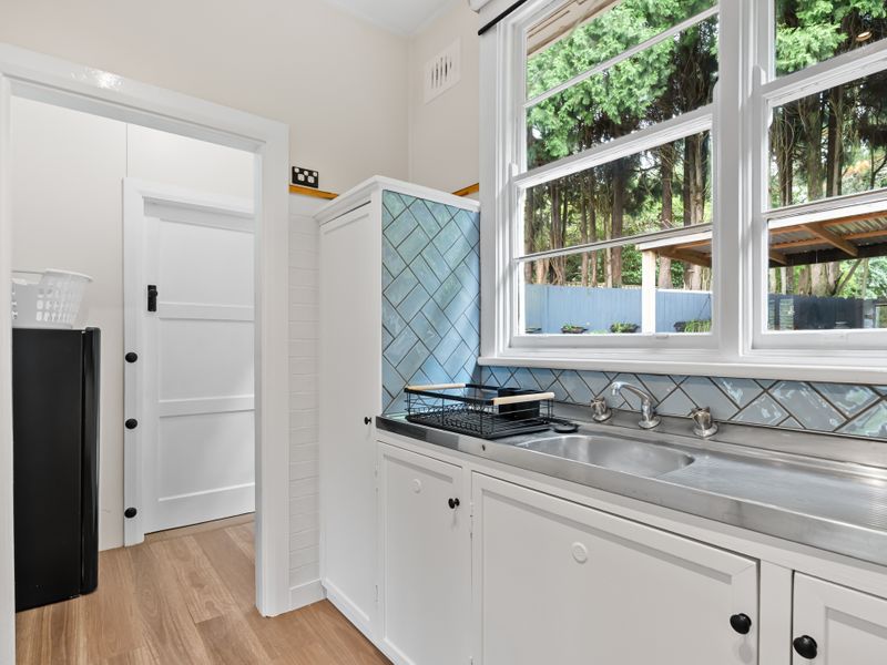 Fresh and functional kitchen with plenty of counter space.