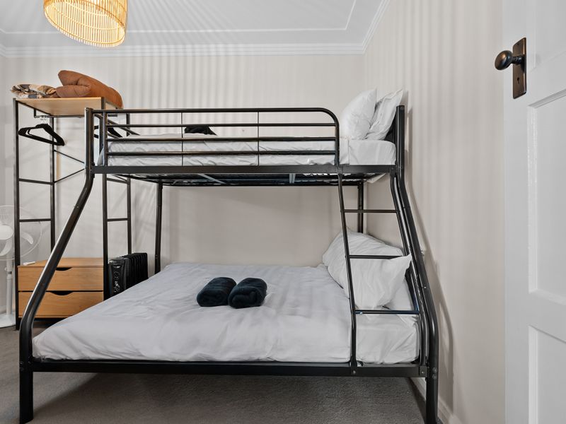 Cozy, functional space with a comfy bunk bed for a restful night's sleep.