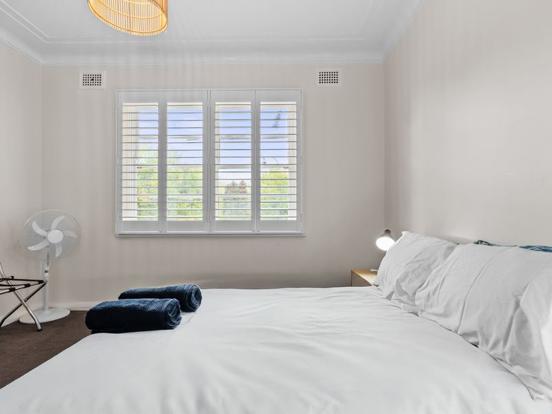 Cozy bedroom with plenty of natural light.