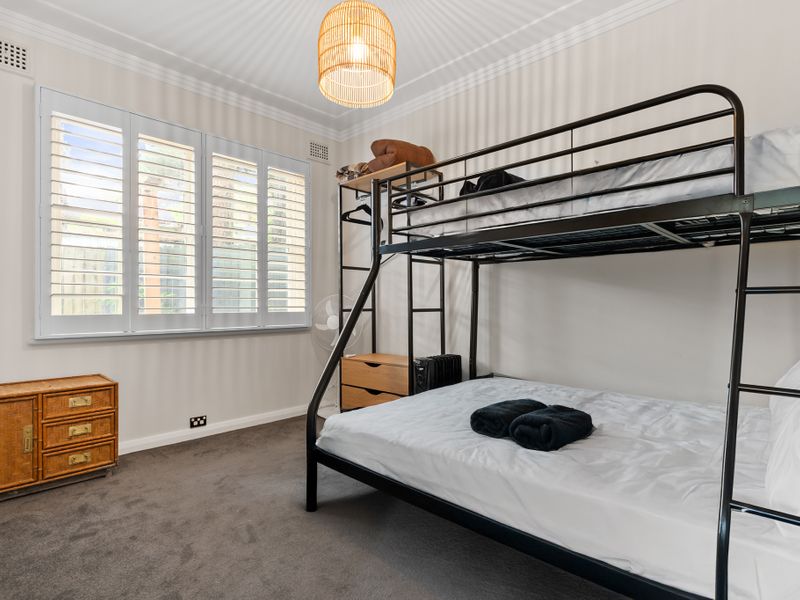Enjoy a comfortable sleep in a well-equipped room with a convenient bunk bed.