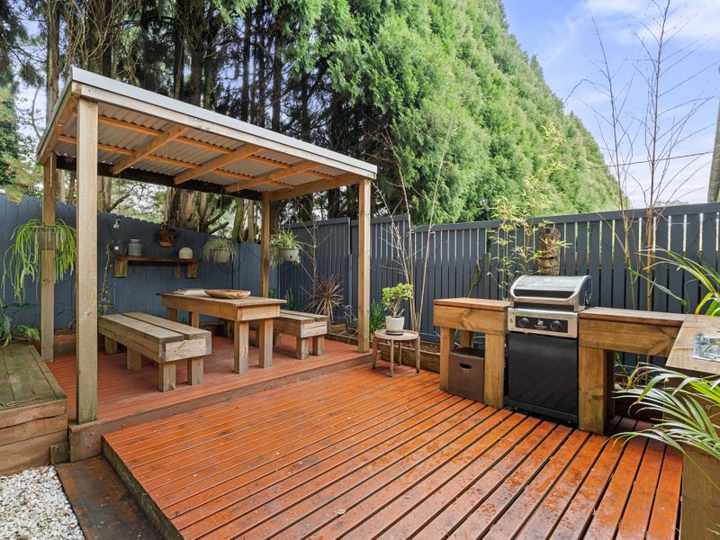 Take in the tranquil garden views from the covered deck area.