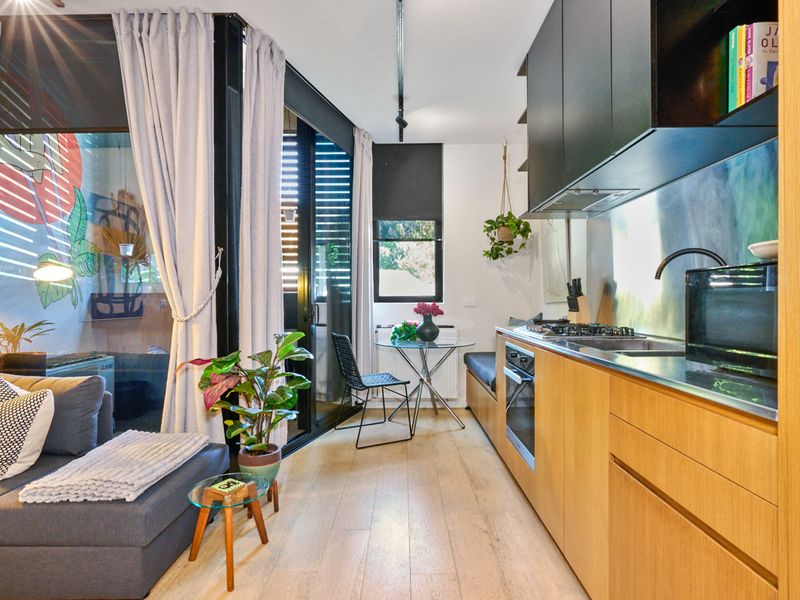 A stylish and modern living space with a cozy kitchen nook 