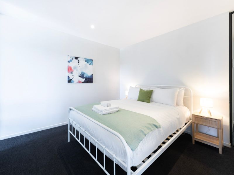 Comfortable bedroom featuring a queen bed for a restful night's sleep