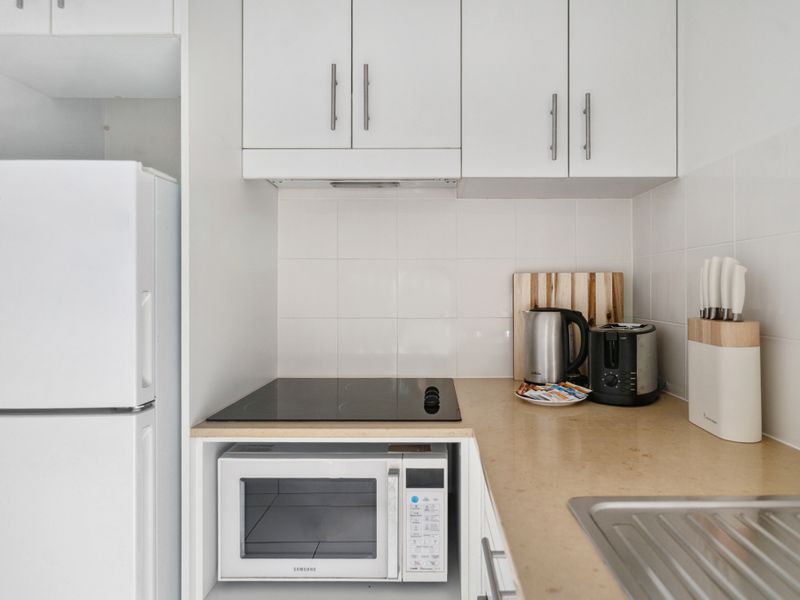 Clean and functional kitchen with contemporary appliances and plenty of space.