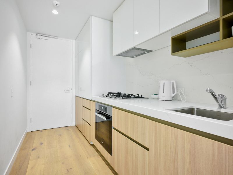 The modern kitchen includes a dishwasher and coffee plunger—ideal for meal prep or your morning coffee.