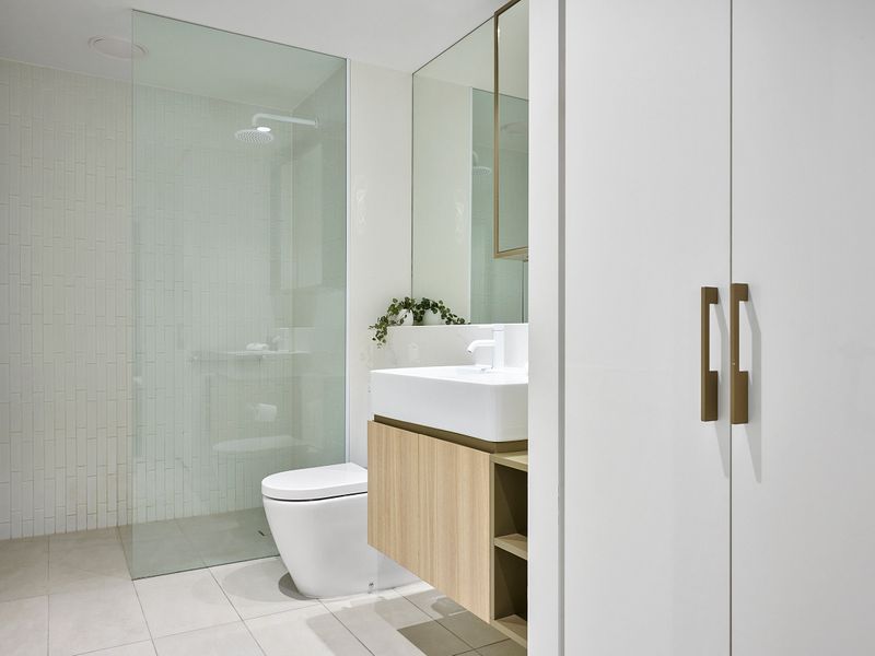Clean bathroom with toilet and shower