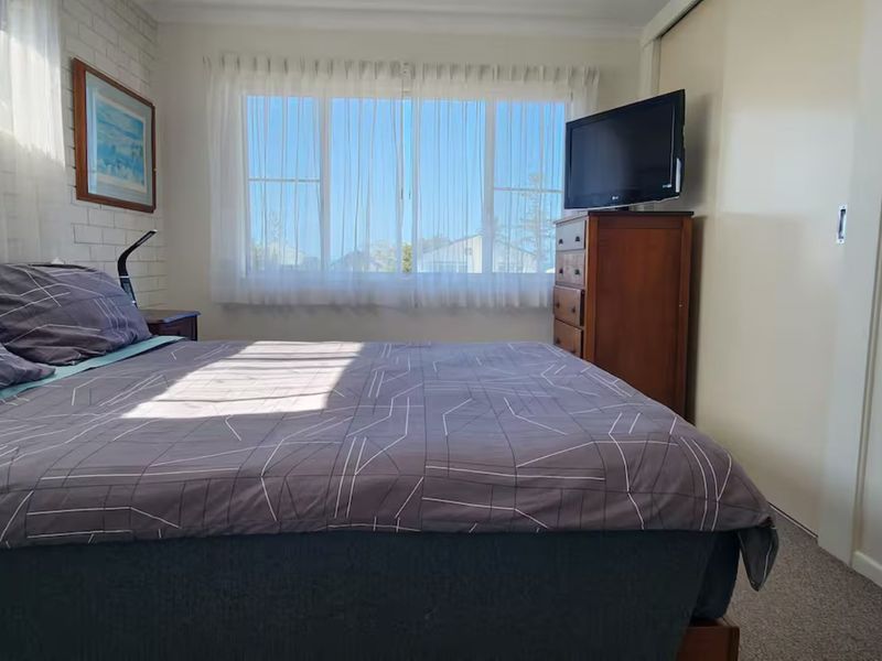 Master bedroom with very own TV for entertainment