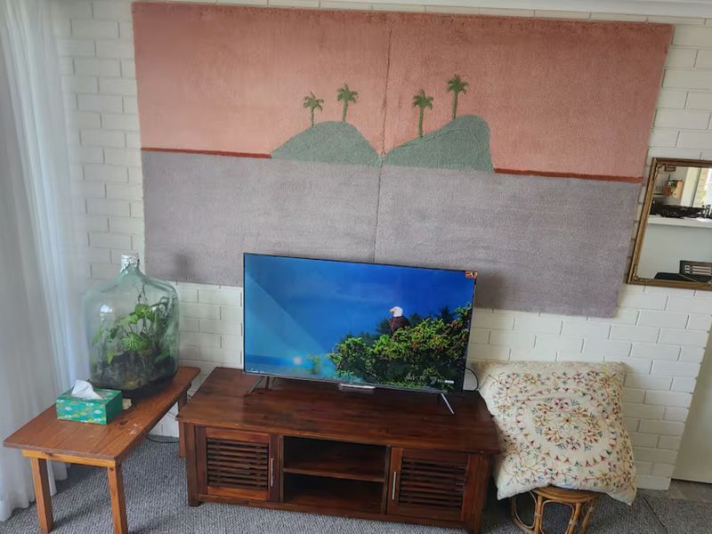 Living room with flat screen TV for entertainment