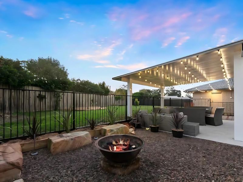 Outdoor lounge with firepit comfort.