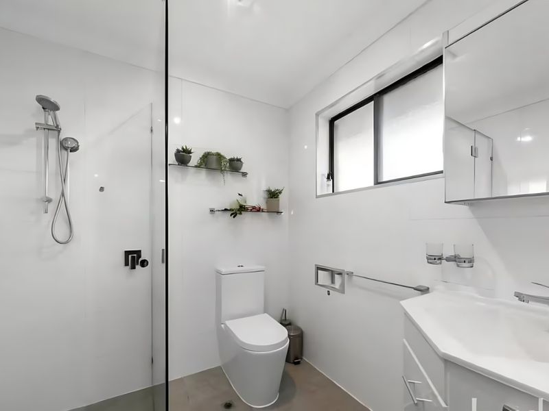 Full bathroom with walk-in shower.