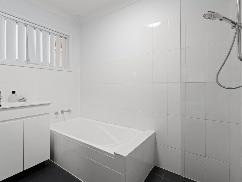 Bathroom with shower and bathtub 